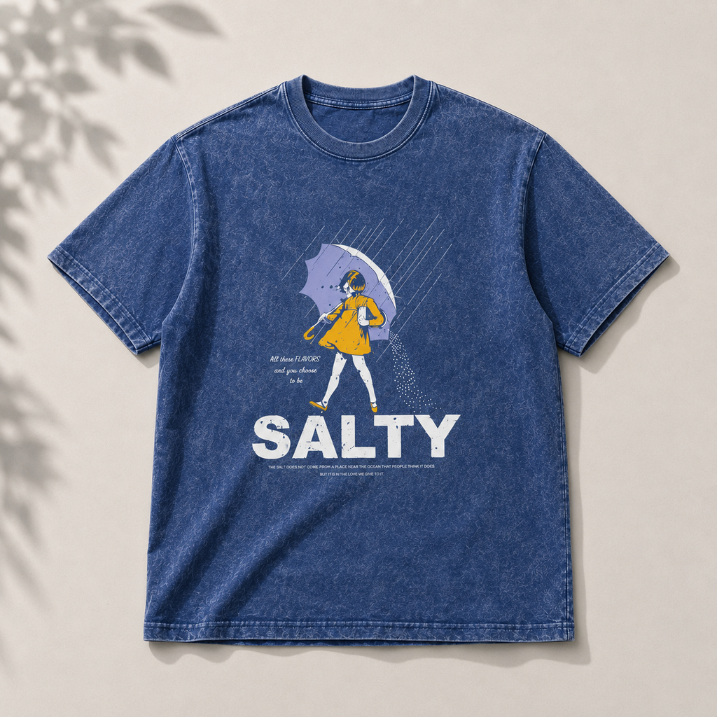 Blue t-shirt with a graphic design and the word 'SALTY' on a beige background