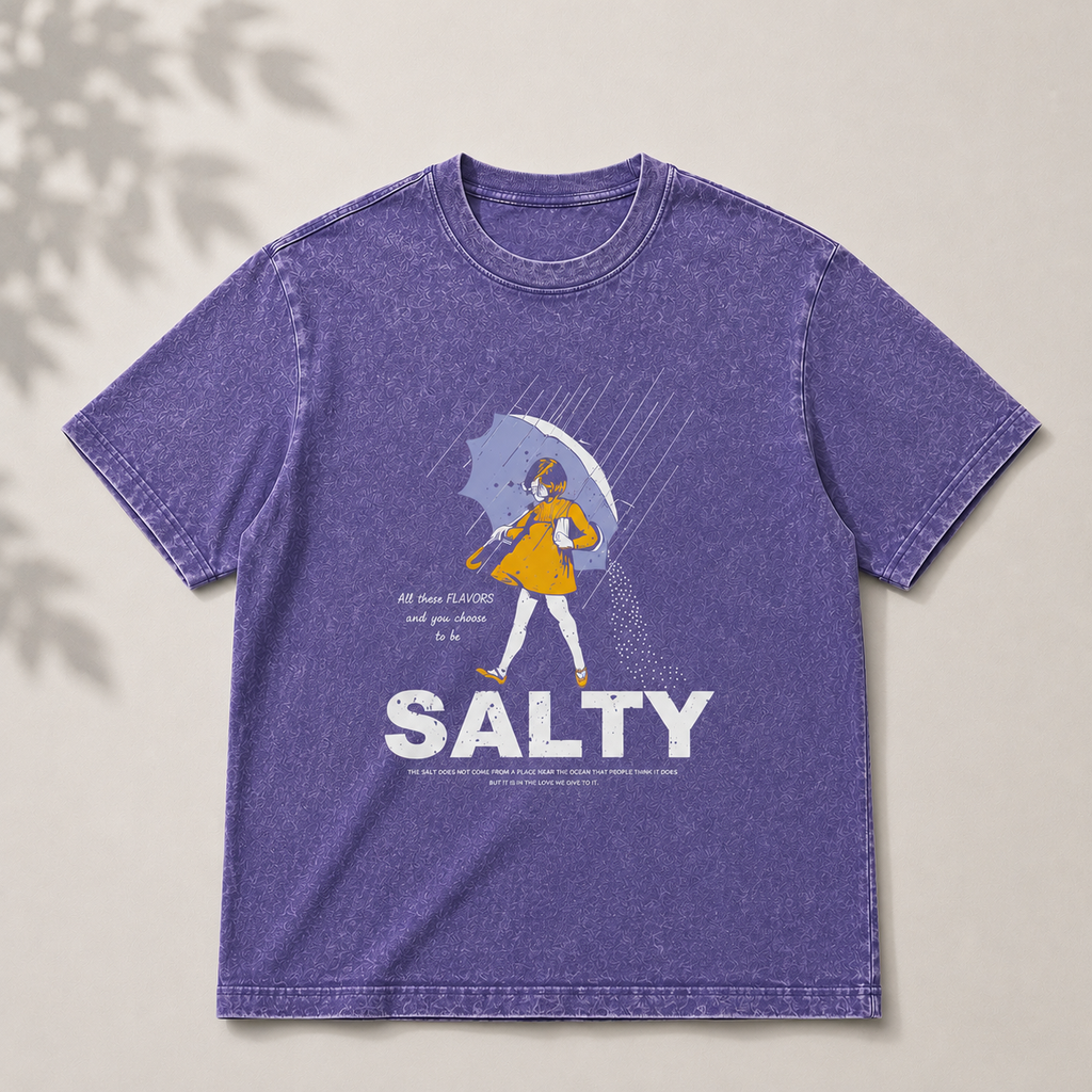 Purple t-shirt with graphic design and 'Salty' text on a neutral background