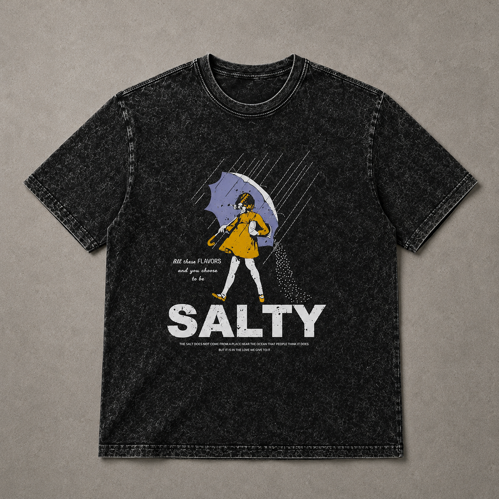 Black t-shirt with graphic design and 'Salty' text on a beige background