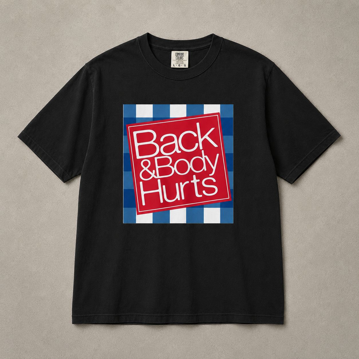 Black t-shirt with a red and white graphic and text on a beige background