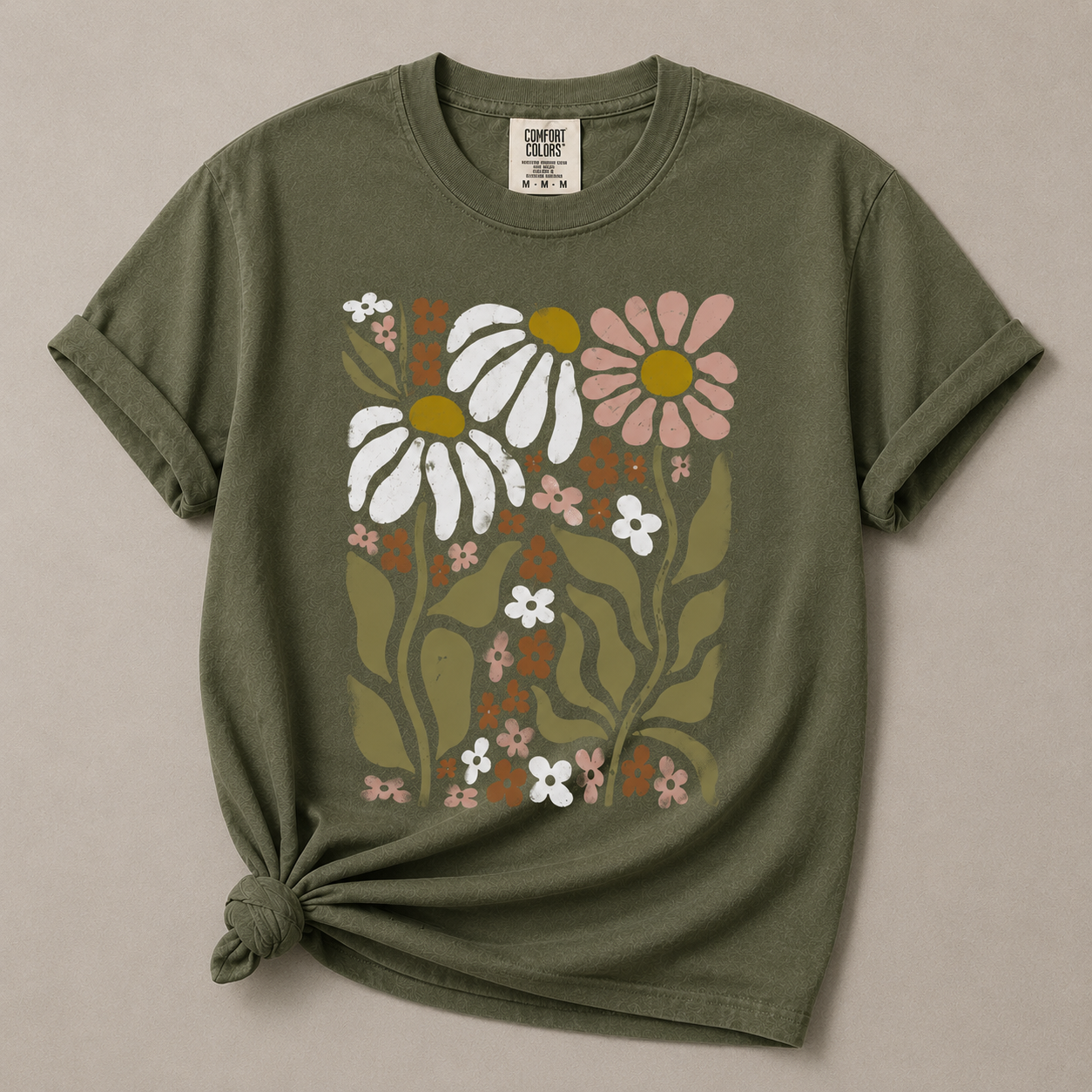 Green t-shirt with floral design on a beige background