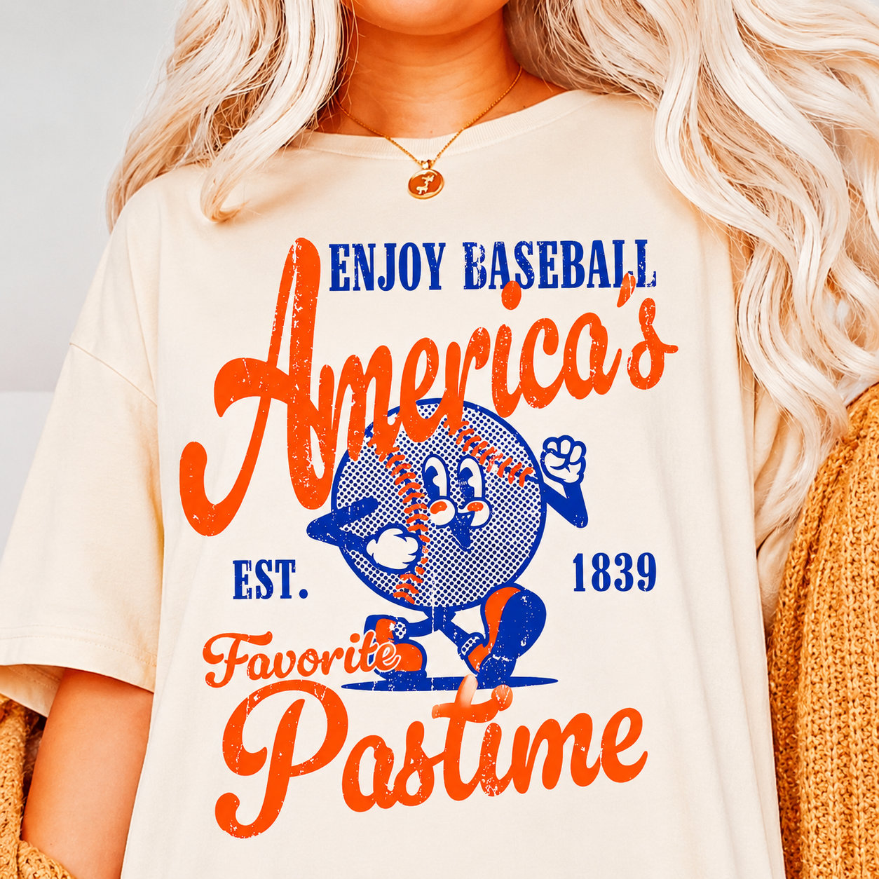 Person wearing a t-shirt with 'Enjoy Baseball, America's Favorite Pastime' text and logo.