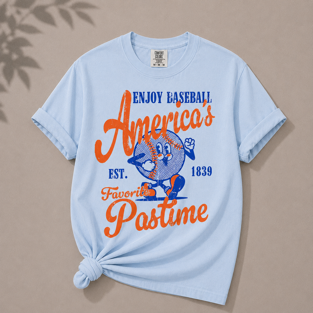 Light blue t-shirt with colorful text and graphics on a beige background