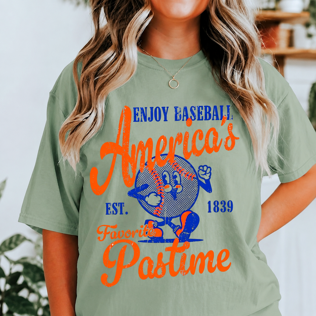 Person wearing a green t-shirt with 'Enjoy Baseball, America's Favorite Pastime' text and logo.