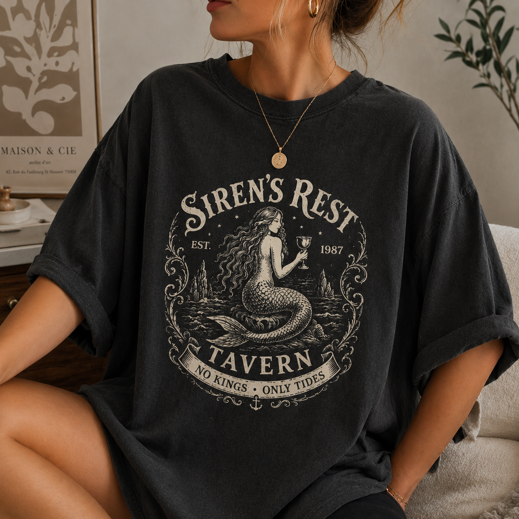 Person wearing a black t-shirt with 'Siren's Rest Tavern' design