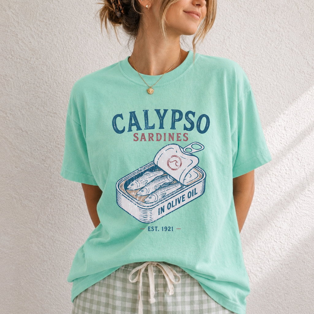 Person wearing a light blue t-shirt with 'Calypso Sardines' graphic design.