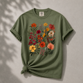 Green t-shirt with floral design on a gray background