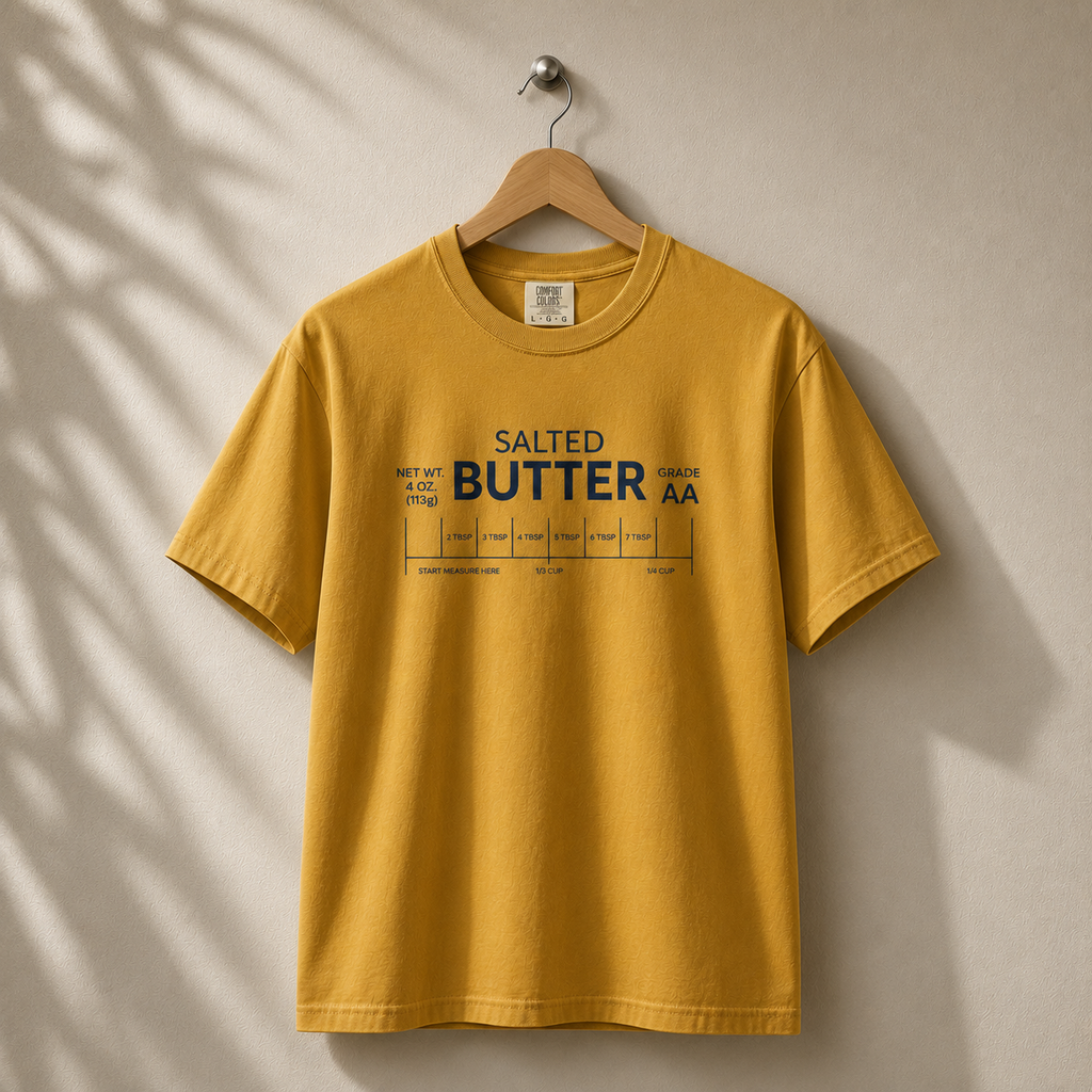 Yellow t-shirt with 'Salted Butter AA' text on a beige background