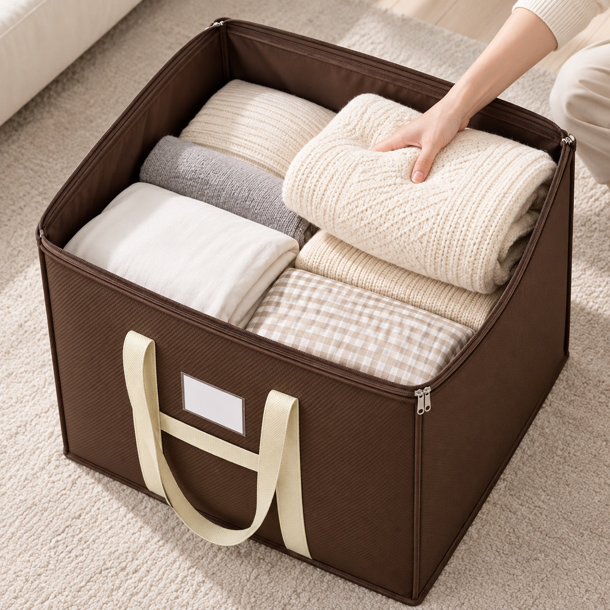 Open brown storage bag filled with clothes