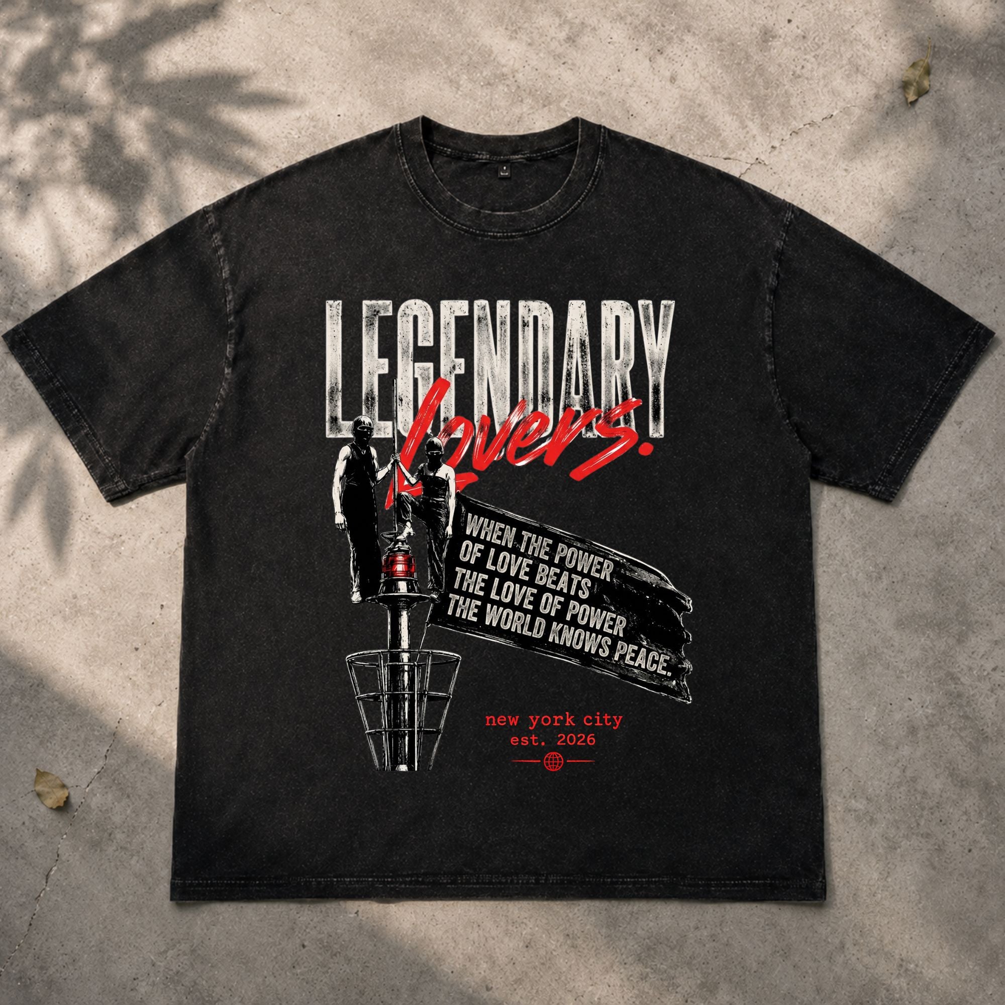 Black vintage washed oversized T-shirt laid flat featuring the Legendary Lovers graphic with bold distressed typography, industrial artwork, and grunge aesthetic. Premium heavyweight streetwear from Form Else Store.