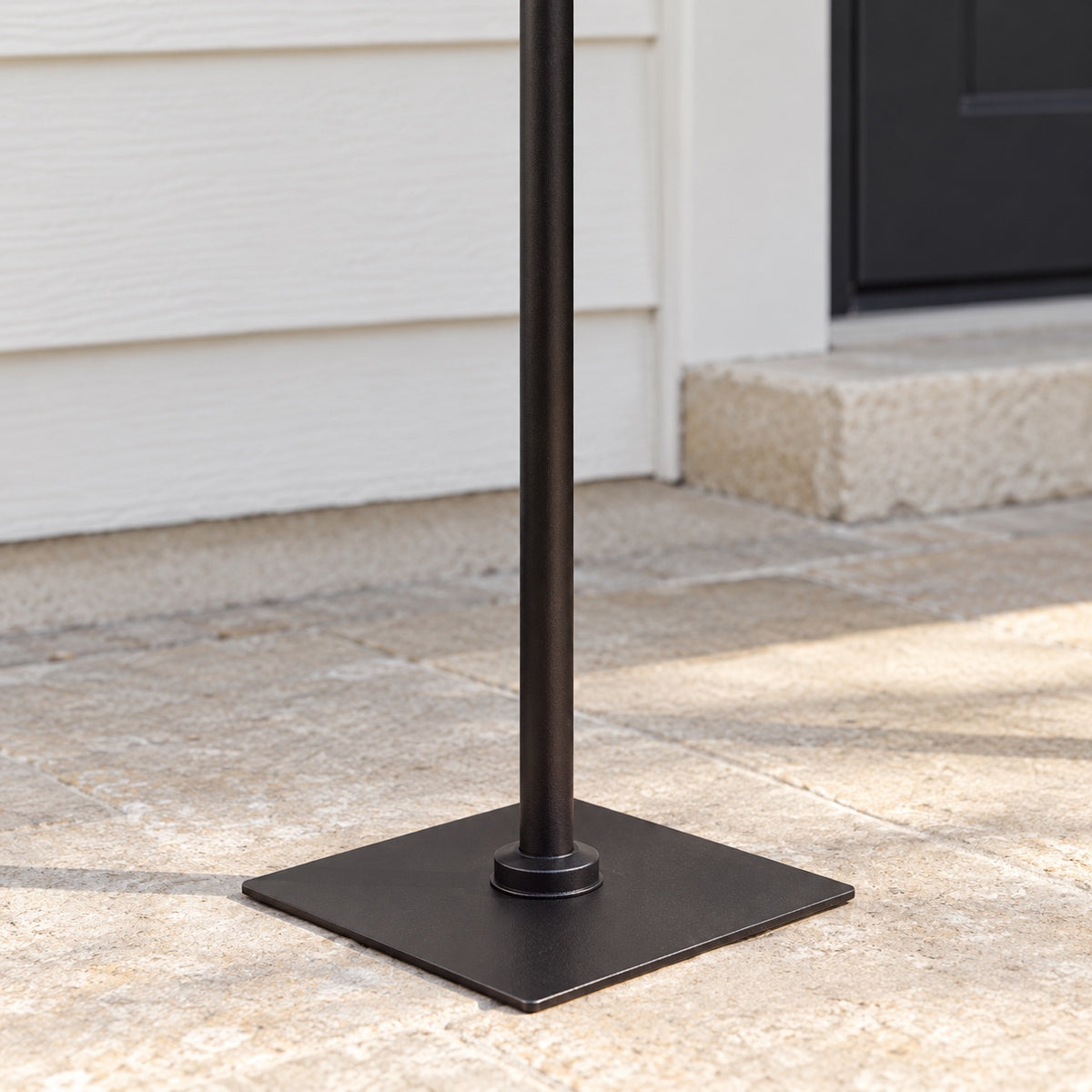 Close-up of black lantern post square base