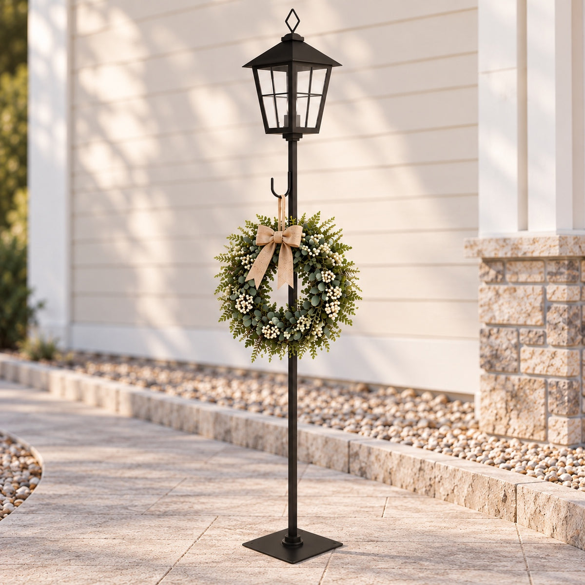 Black lantern post with wreath in daylight