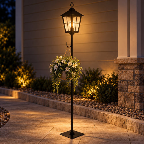 Black lantern post with hanging flower basket at night