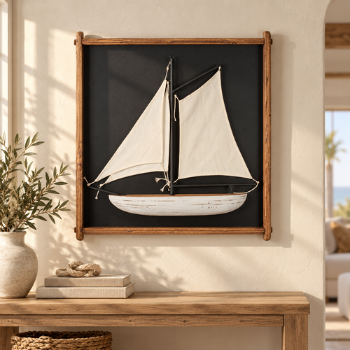 Framed sailboat wall art above a light oak console in a coastal living room