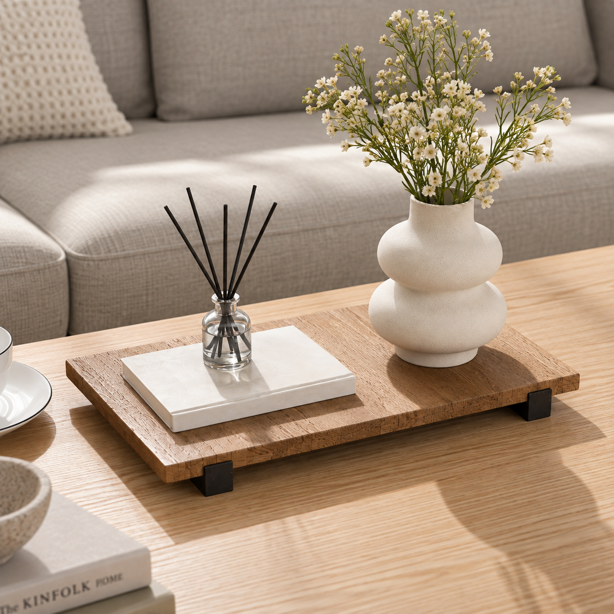 Natural wood decorative riser styled on a living room coffee table