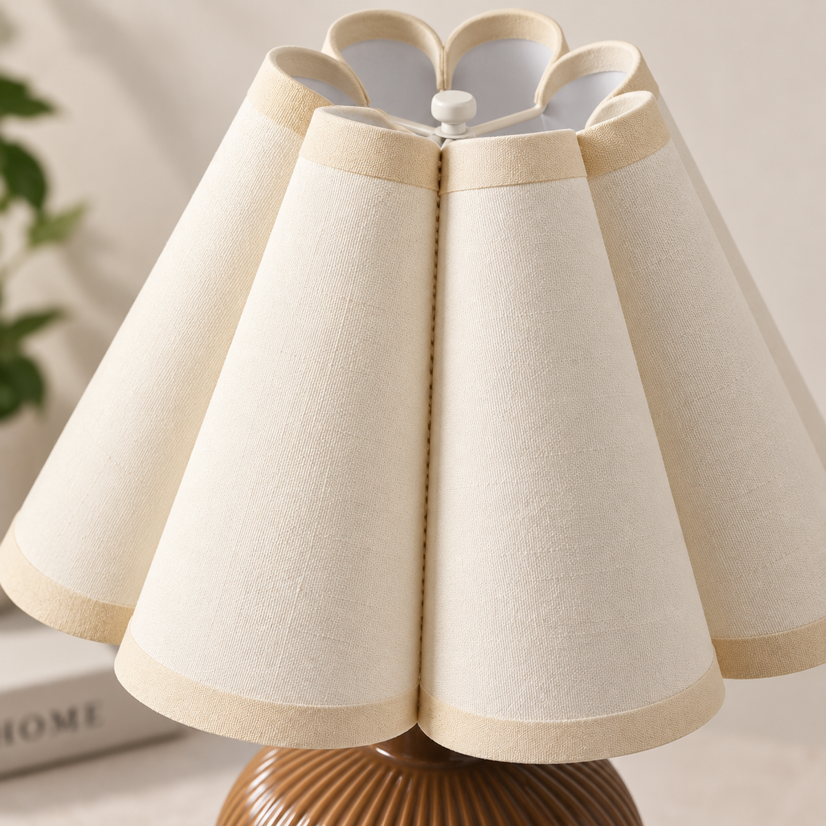 Close-up of the cream scalloped fabric shade on the accent lamp