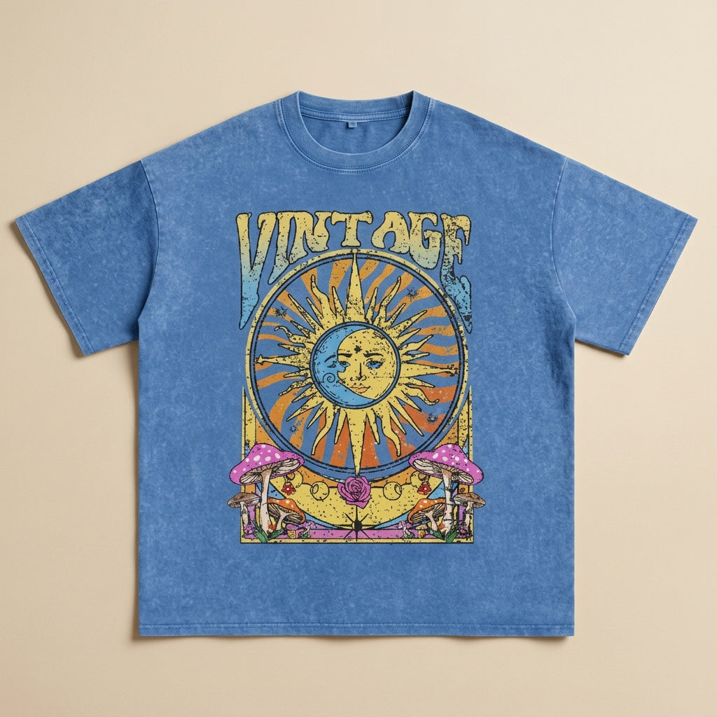 Light blue vintage washed oversized t-shirt with celestial sun and moon graphic